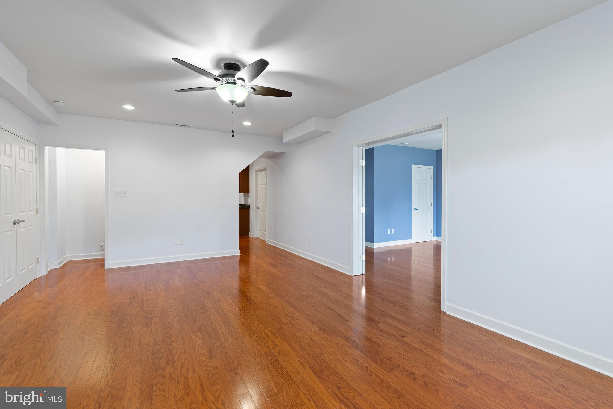 67 Merry Knoll Court Conowingo, MD 21918 - Photo 29 of 50 a view of an empty room with wooden floor and a ceiling fan