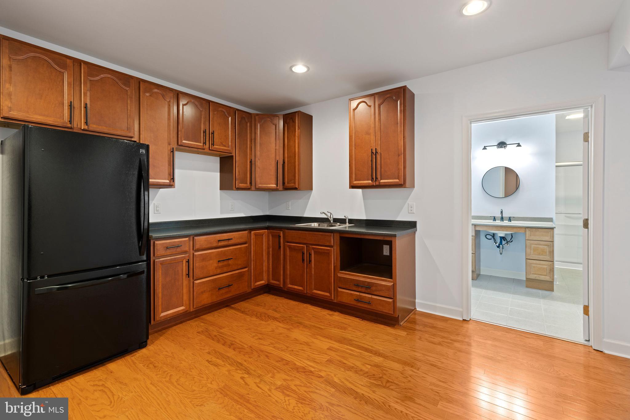 67 Merry Knoll Court Conowingo, MD 21918 - Photo 32 of 50 a kitchen with stainless steel appliances granite countertop a refrigerator and a stove top oven