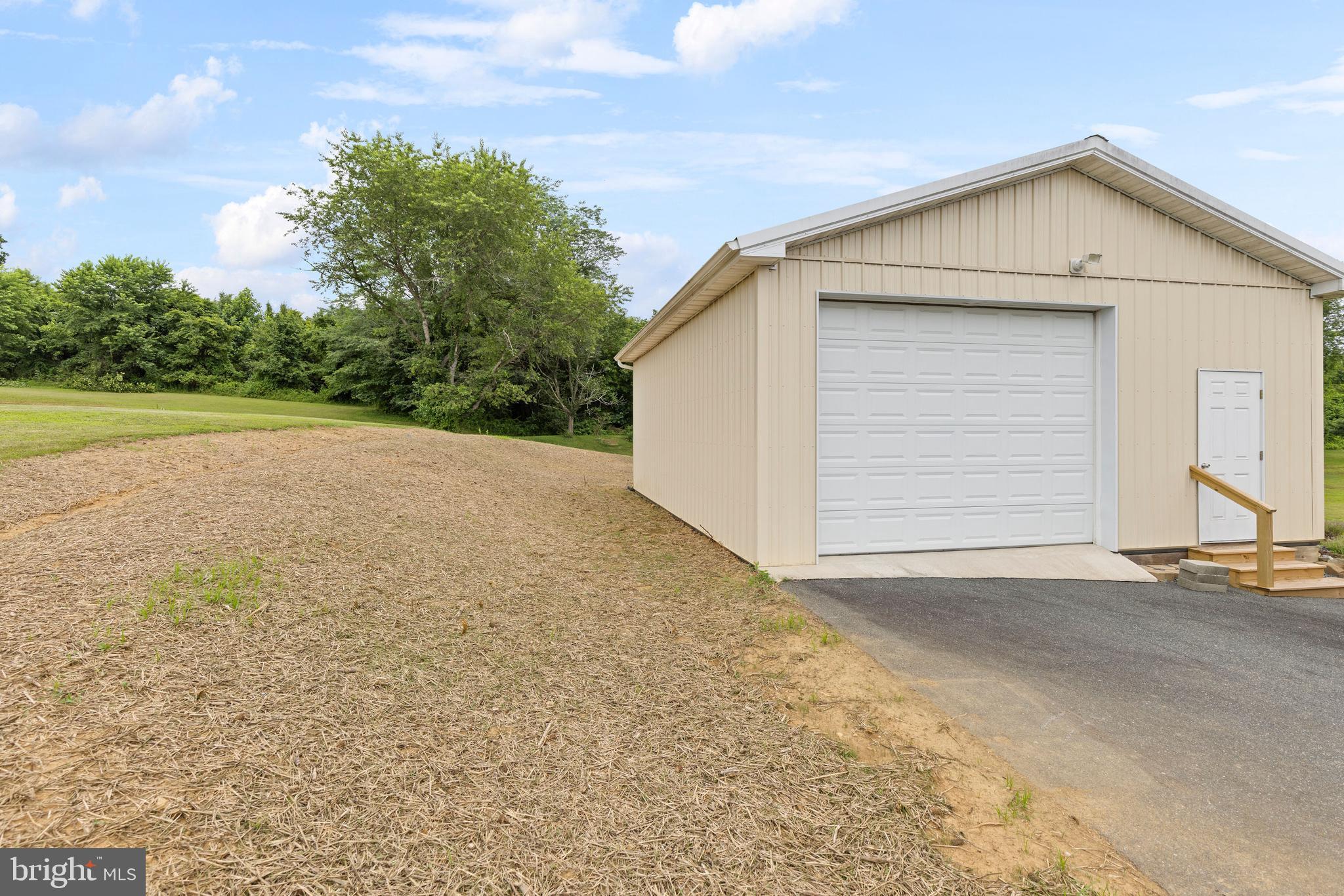 67 Merry Knoll Court Conowingo, MD 21918 - Photo 42 of 50 a view of backyard of house and garage