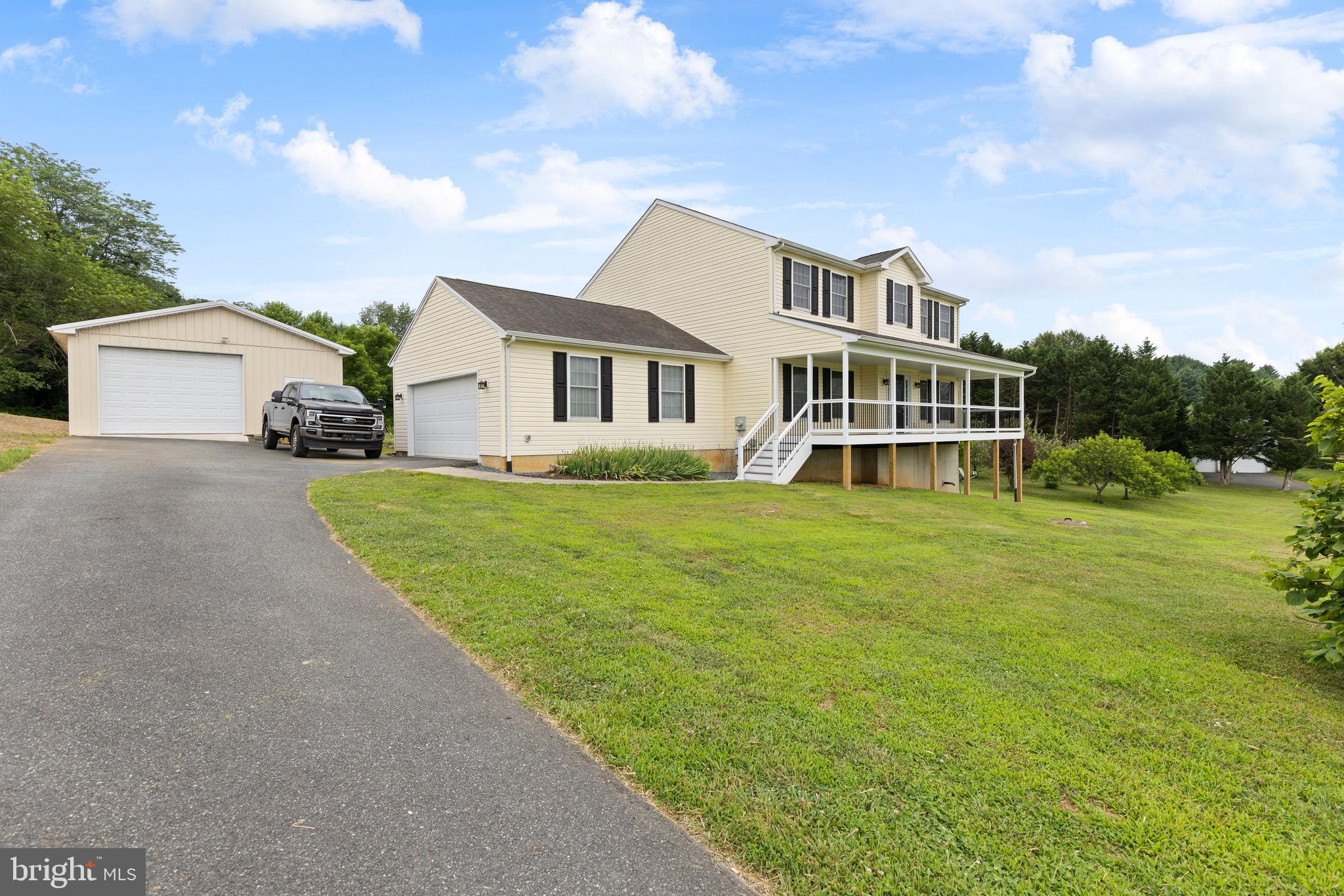 67 Merry Knoll Court Conowingo, MD 21918 - Photo 49 of 50 a front view of a house with a garden and trees