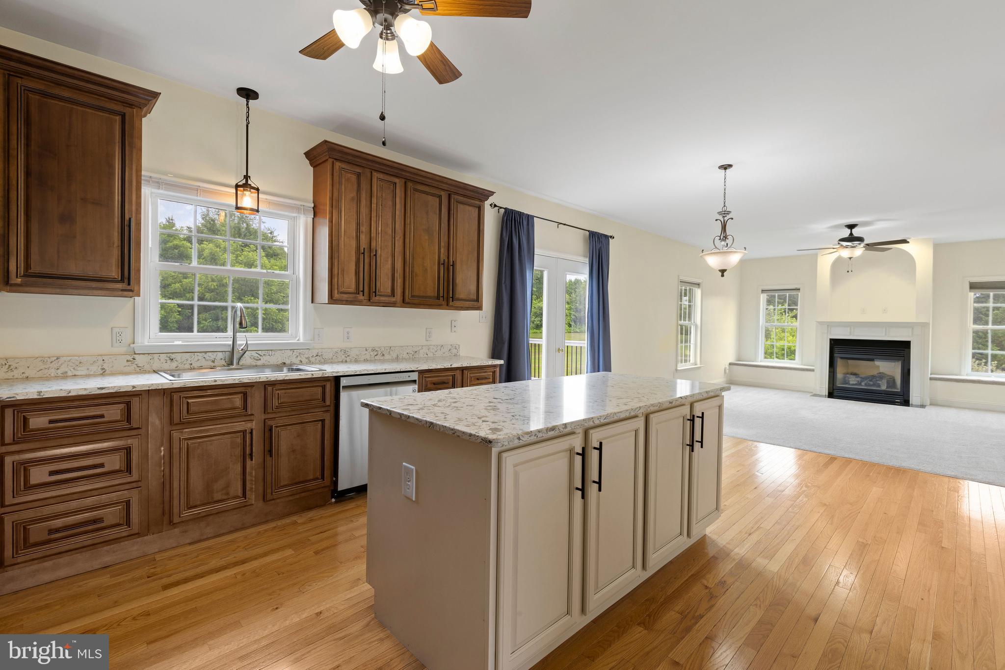 67 Merry Knoll Court Conowingo, MD 21918 - Photo 9 of 50 a kitchen with stainless steel appliances granite countertop a stove cabinets and wooden floor