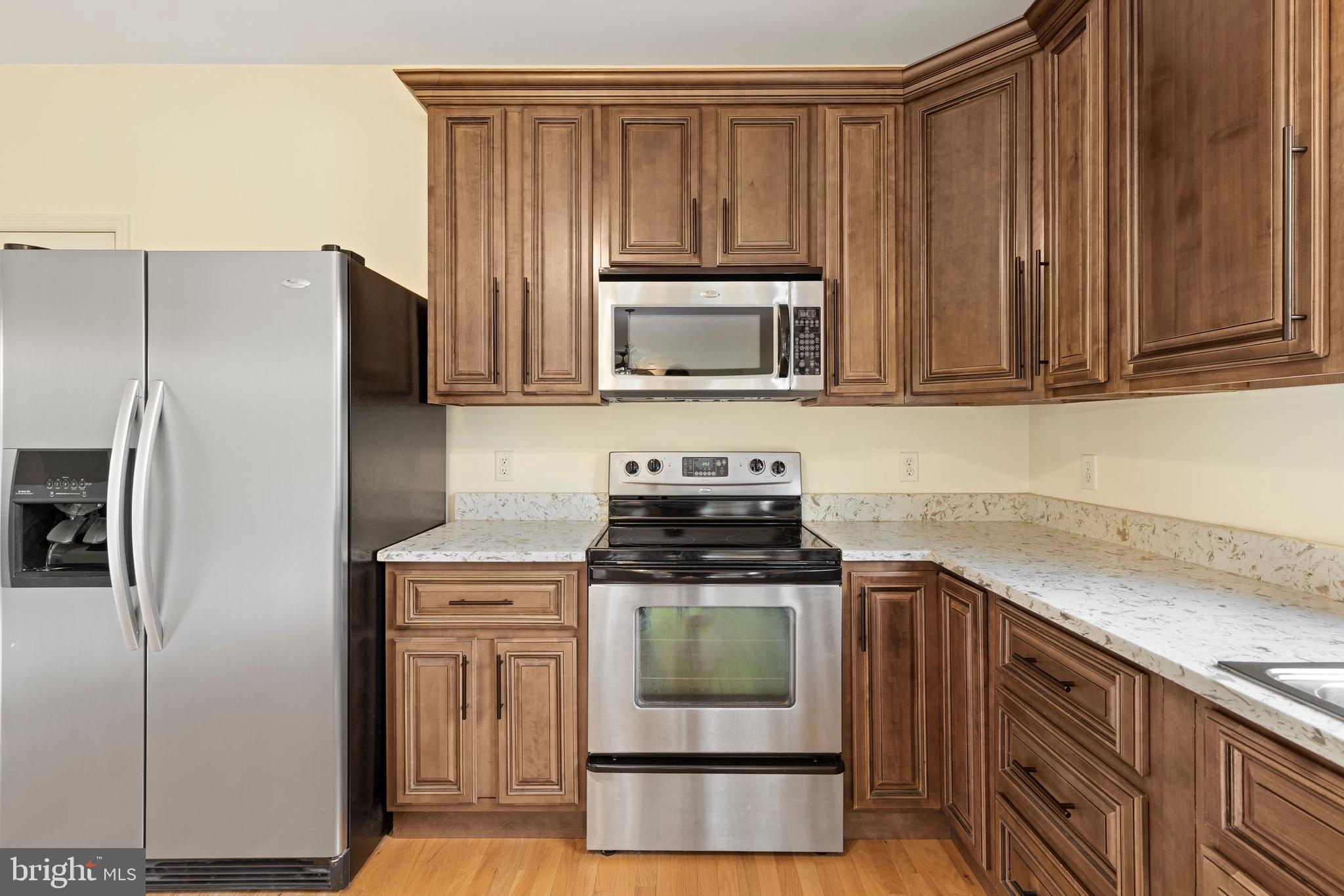 67 Merry Knoll Court Conowingo, MD 21918 - Photo 10 of 50 a kitchen with a stove microwave and refrigerator