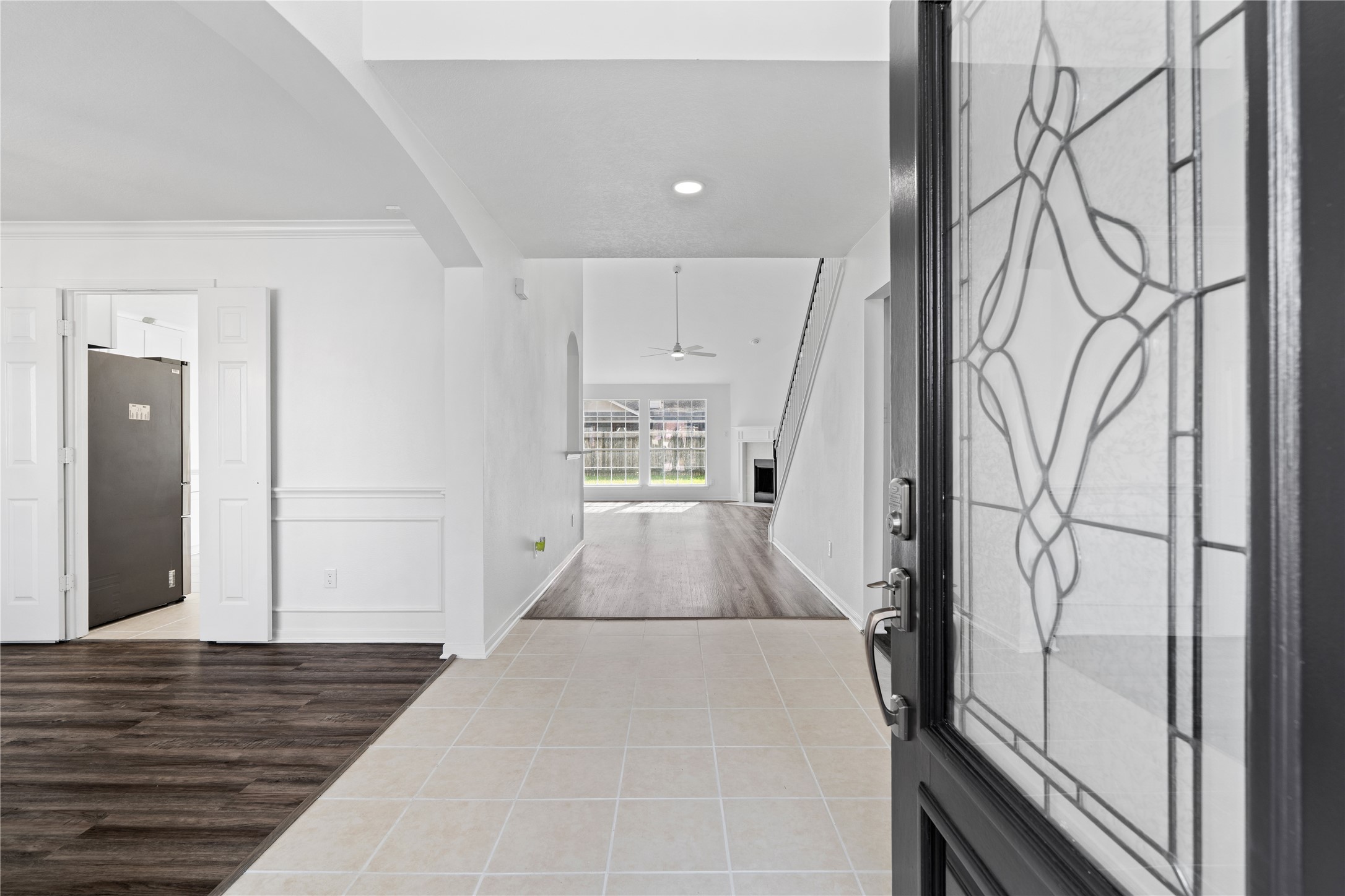 434 Pinewood Ridge Drive Spring, TX 77386 - Photo 2 of 32 a view of a hallway with wooden floor and staircase