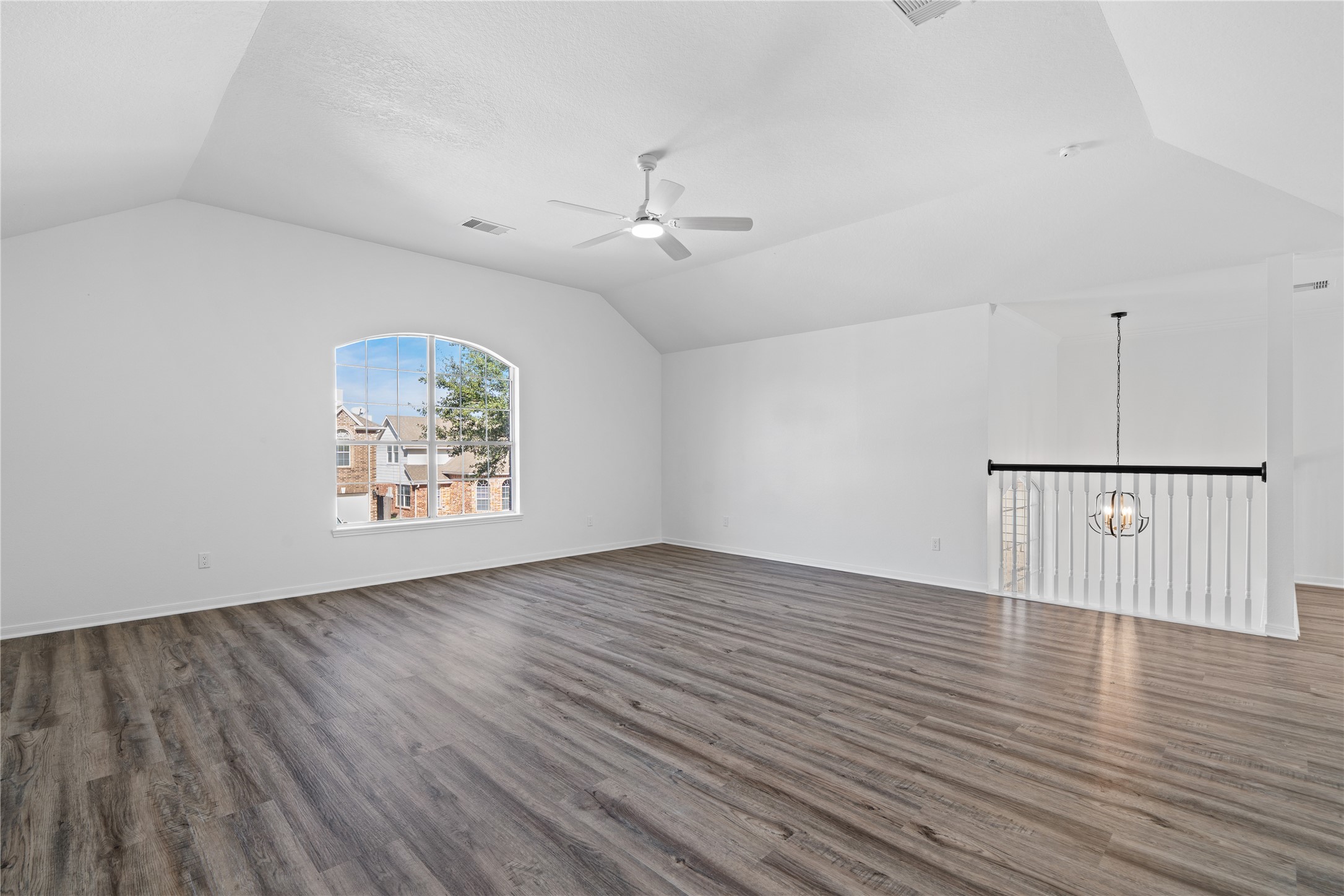 434 Pinewood Ridge Drive Spring, TX 77386 - Photo 22 of 32 an empty room with wooden floor ceiling fan and windows