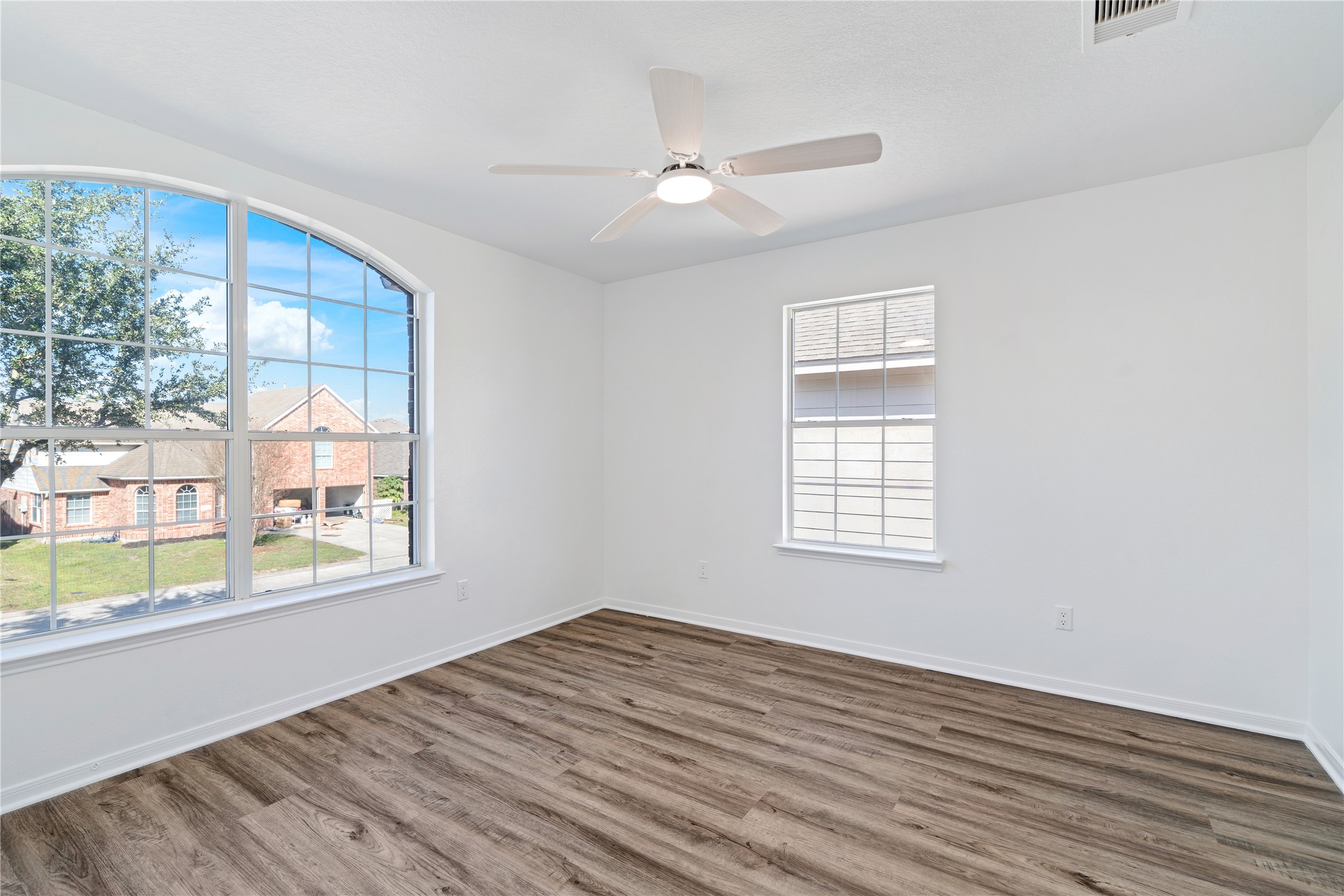 434 Pinewood Ridge Drive Spring, TX 77386 - Photo 26 of 32 a view of an empty room with wooden floor and a window