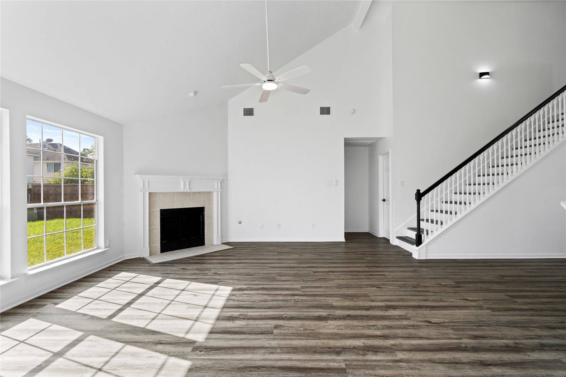 434 Pinewood Ridge Drive Spring, TX 77386 - Photo 7 of 32 a view of an empty room with wooden floor and a fireplace