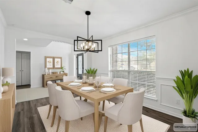 a view of a dining room with furniture window and wooden floor