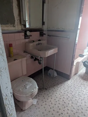a bathroom with a sink and a toilet