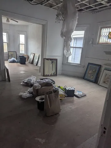 a bed room with furniture and a window