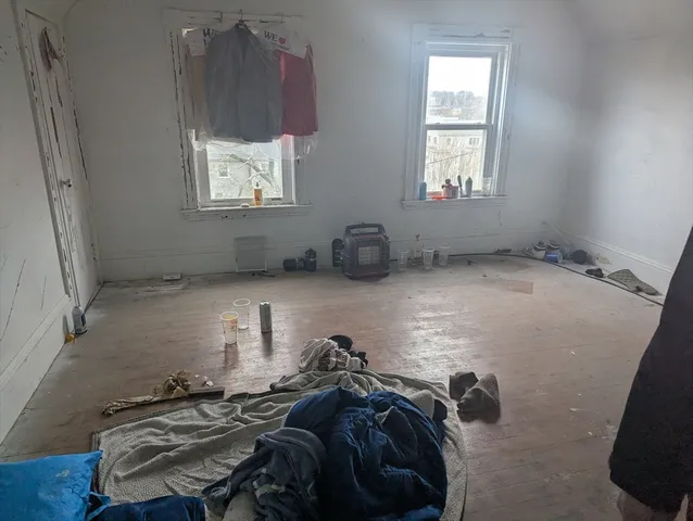 a bed room with a bed and a window