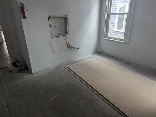a view of a room with workbench and window