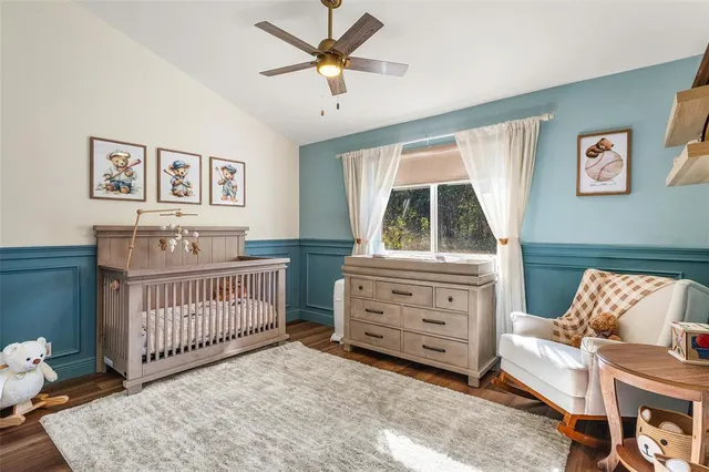 a view of a swimming pool with a patio and dining space