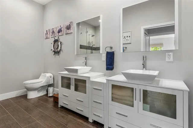 an aerial view of a house with a yard and garden