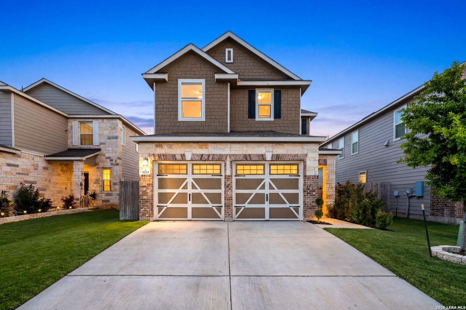 a front view of a house with a yard