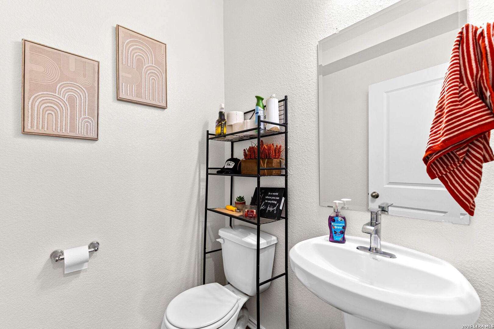 1029 Santiam Street Georgetown, TX 78626 - Photo 15 of 37 a bathroom with a toilet sink and mirror