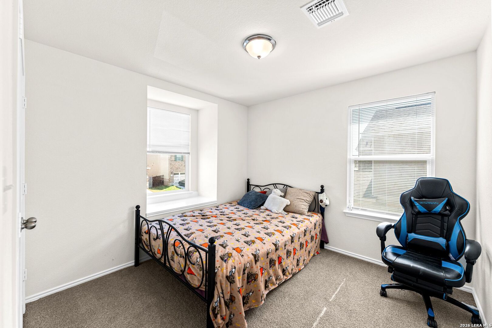 1029 Santiam Street Georgetown, TX 78626 - Photo 16 of 37 a bedroom with a bed and a window