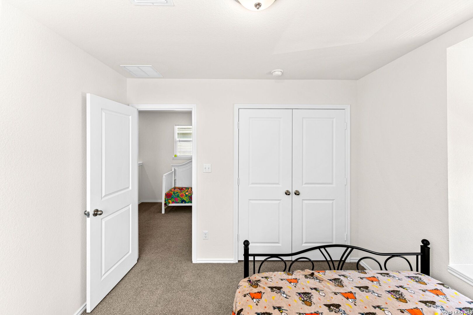 1029 Santiam Street Georgetown, TX 78626 - Photo 17 of 37 a bedroom with a bed and a table
