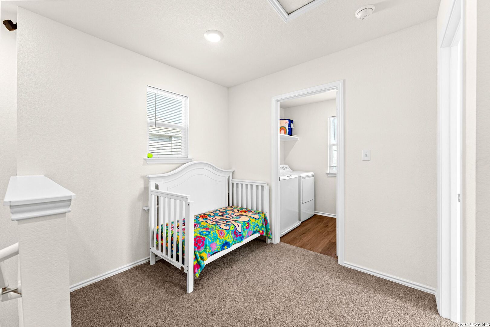 1029 Santiam Street Georgetown, TX 78626 - Photo 19 of 37 a bedroom with bed and a window