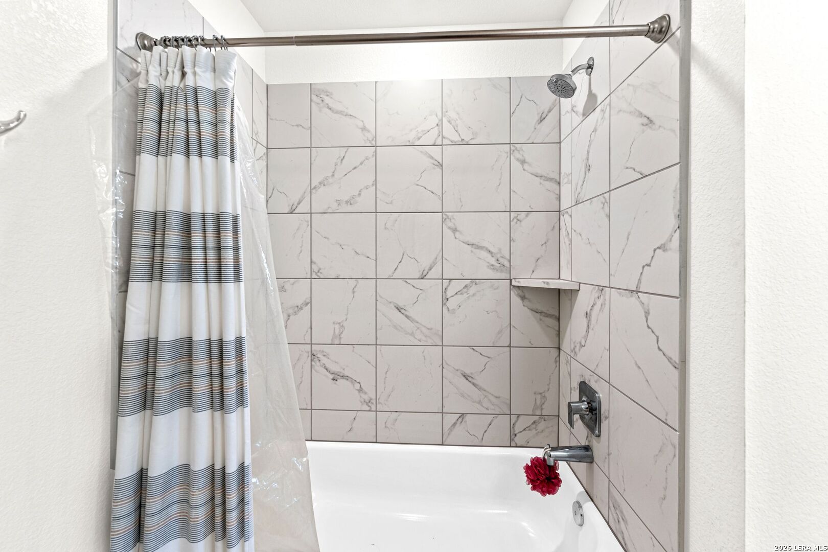 1029 Santiam Street Georgetown, TX 78626 - Photo 22 of 37 a bathroom with a bathtub and shower