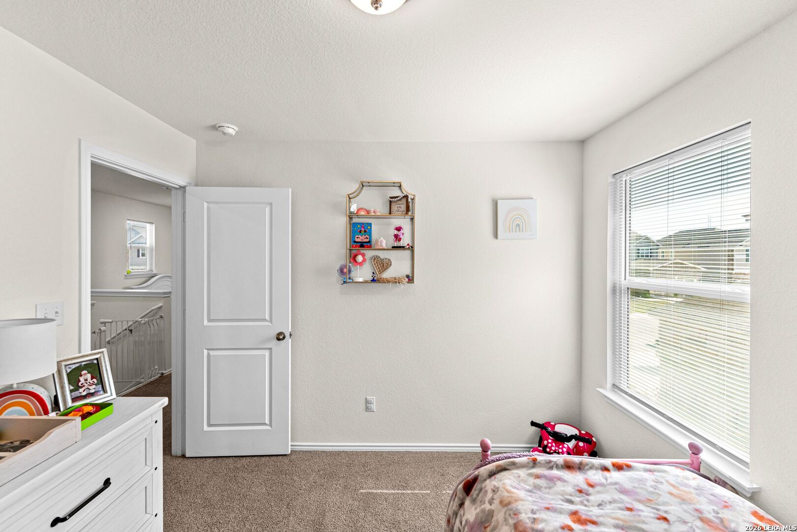 1029 Santiam Street Georgetown, TX 78626 - Photo 24 of 37 a bed room with a bed and a window