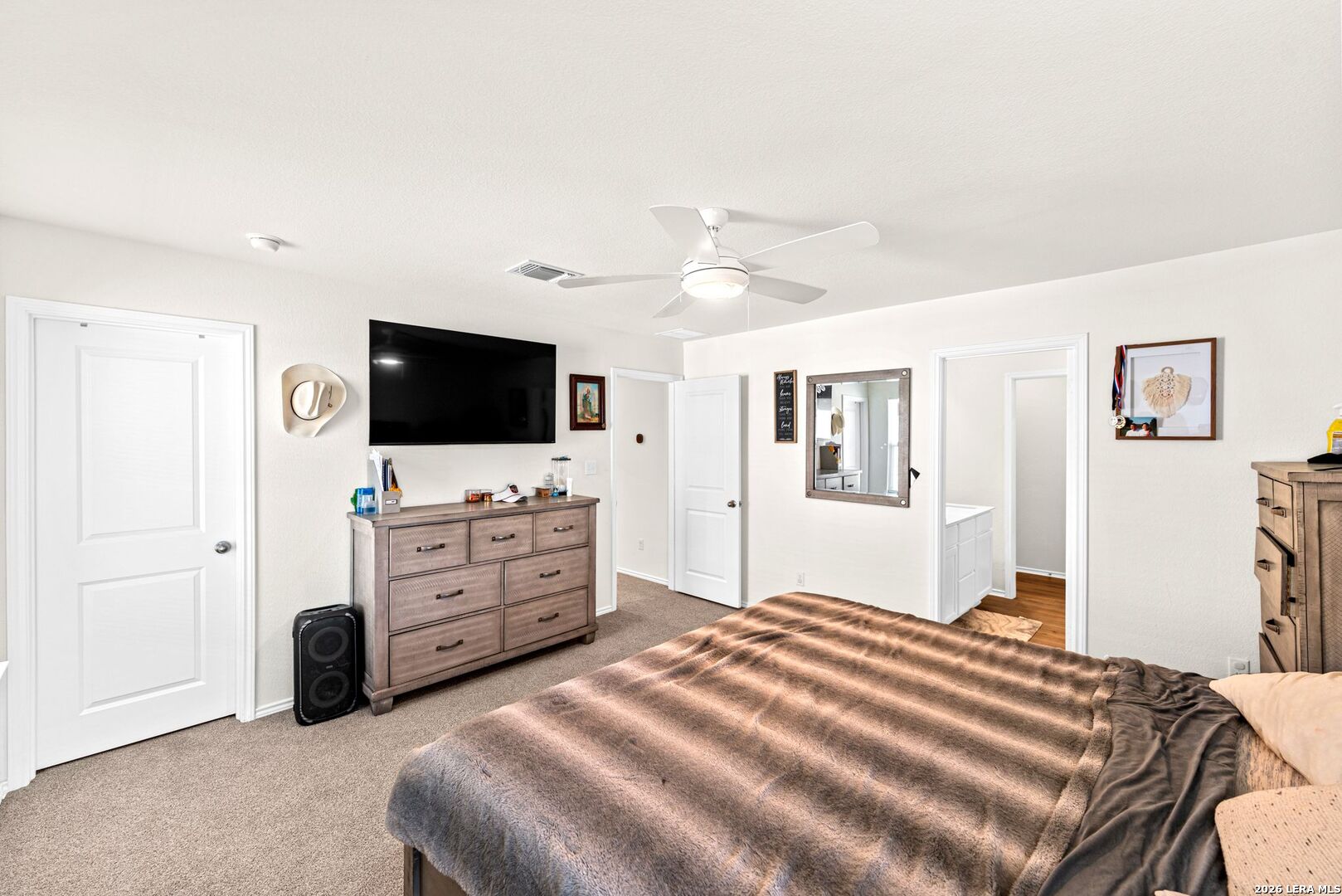 1029 Santiam Street Georgetown, TX 78626 - Photo 26 of 37 a bedroom with a bed and a flat screen tv
