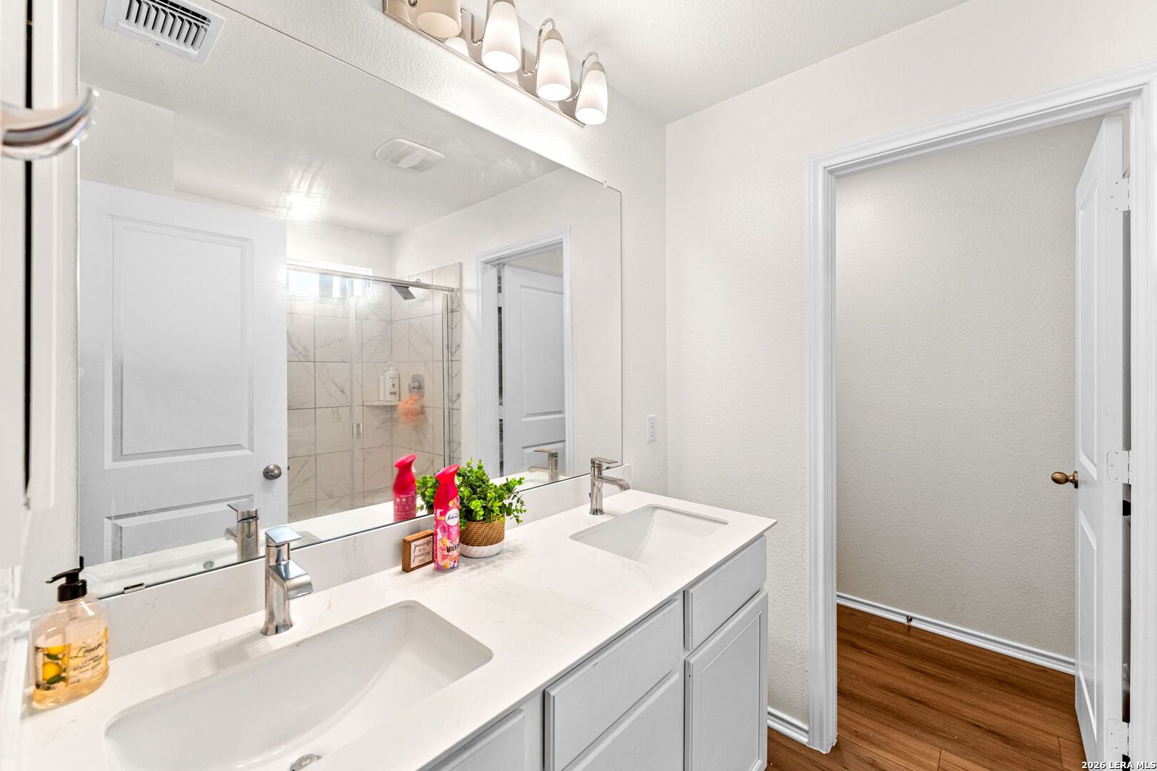 1029 Santiam Street Georgetown, TX 78626 - Photo 28 of 37 a bathroom with a tub sink mirror and vanity
