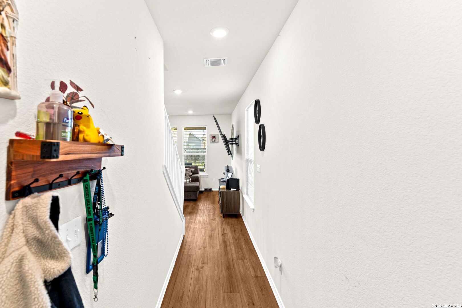 1029 Santiam Street Georgetown, TX 78626 - Photo 4 of 37 a view of a hallway with wooden floor and staircase