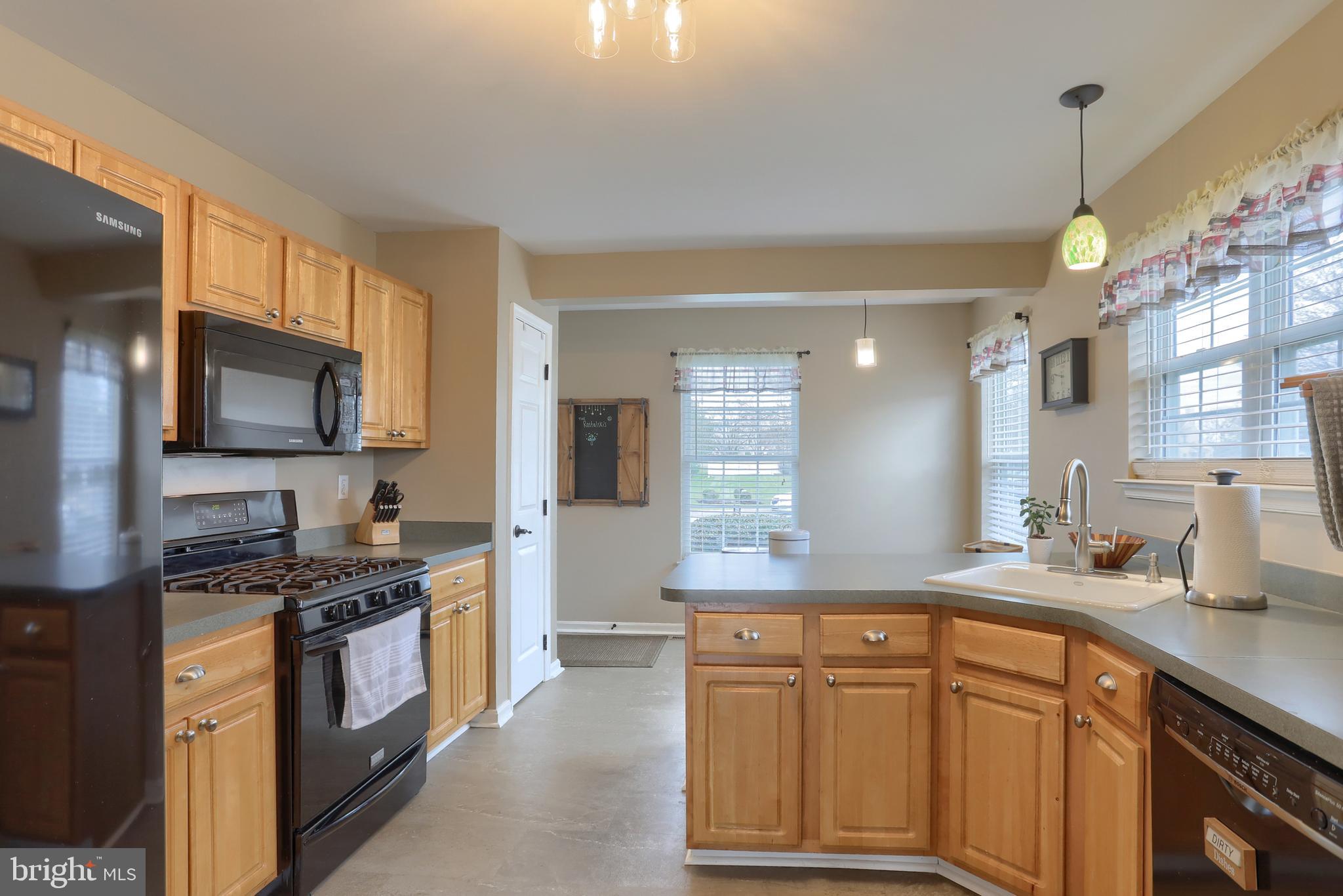 6456 Terrace Court Harrisburg, PA 17111 - Photo 13 of 39 a kitchen with granite countertop a sink stainless steel appliances and cabinets