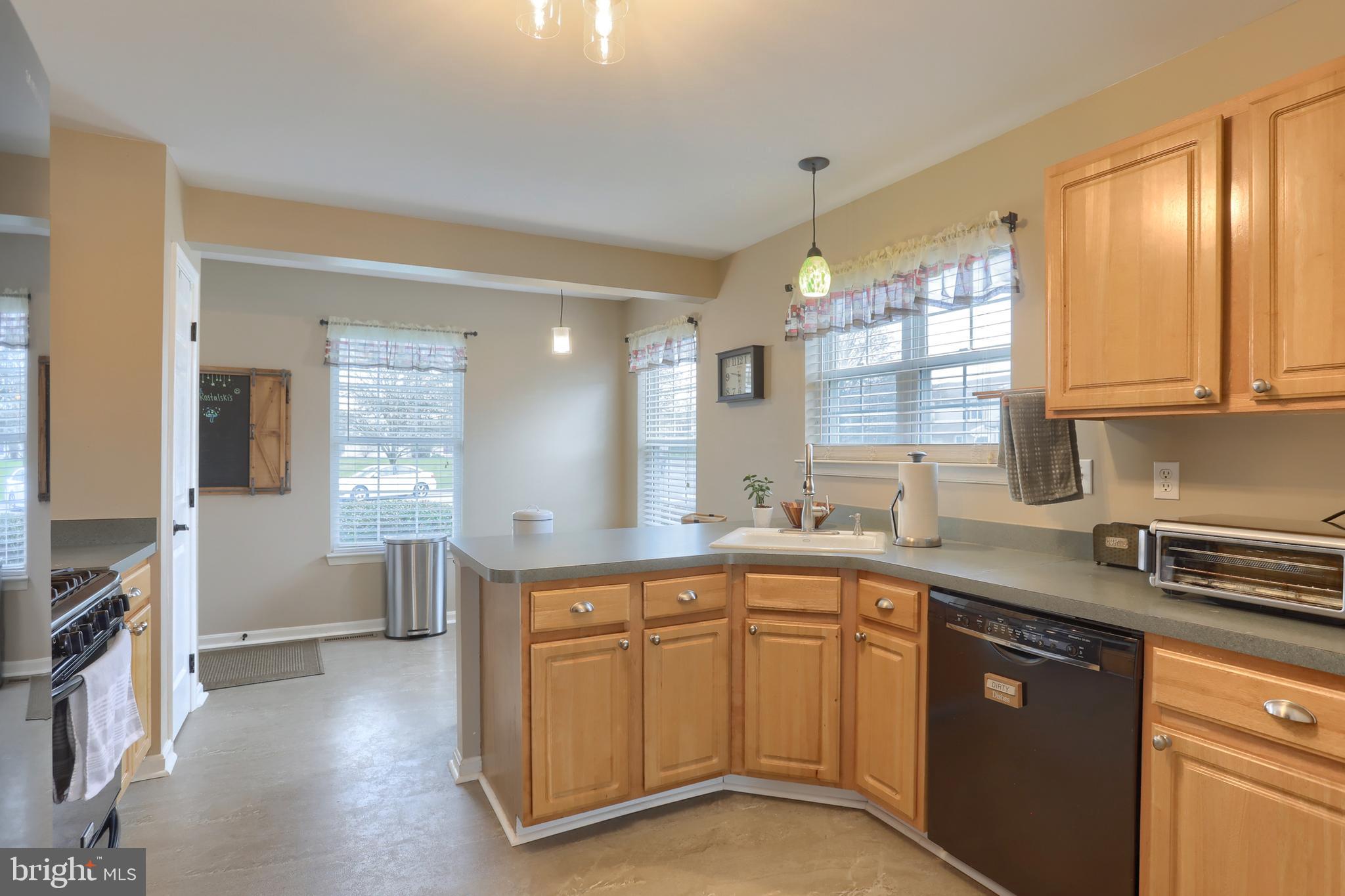 6456 Terrace Court Harrisburg, PA 17111 - Photo 14 of 39 a kitchen with a sink stove and cabinets
