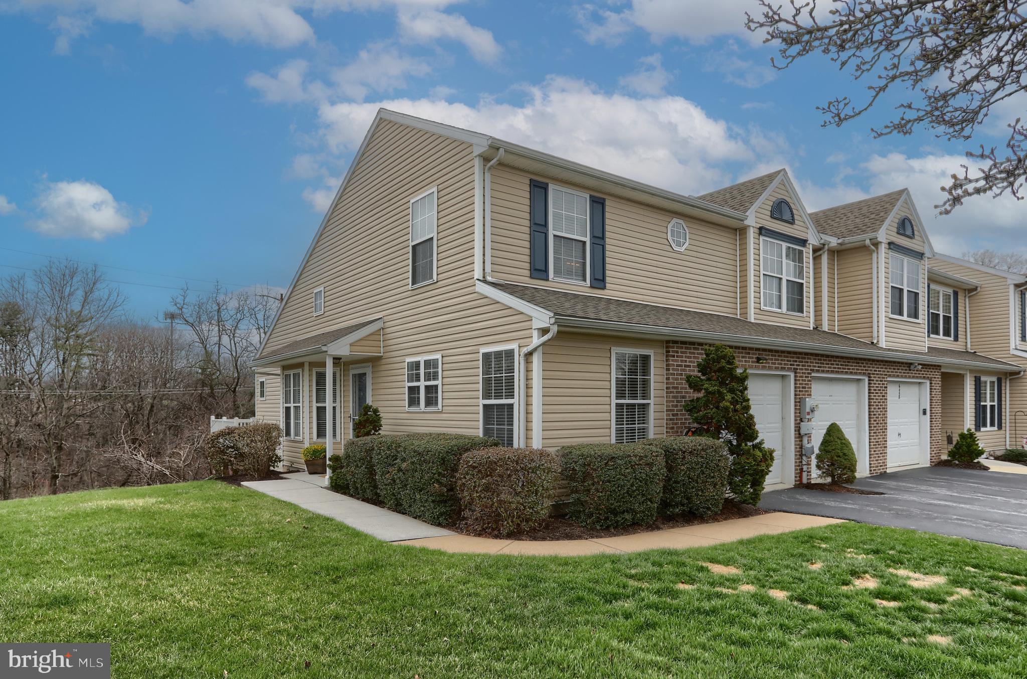 6456 Terrace Court Harrisburg, PA 17111 - Photo 2 of 39 a front view of a house with a yard and potted plants
