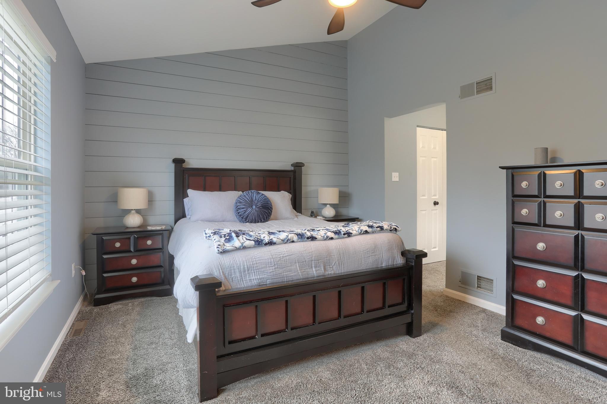6456 Terrace Court Harrisburg, PA 17111 - Photo 21 of 39 a bedroom with a bed a dresser and a window