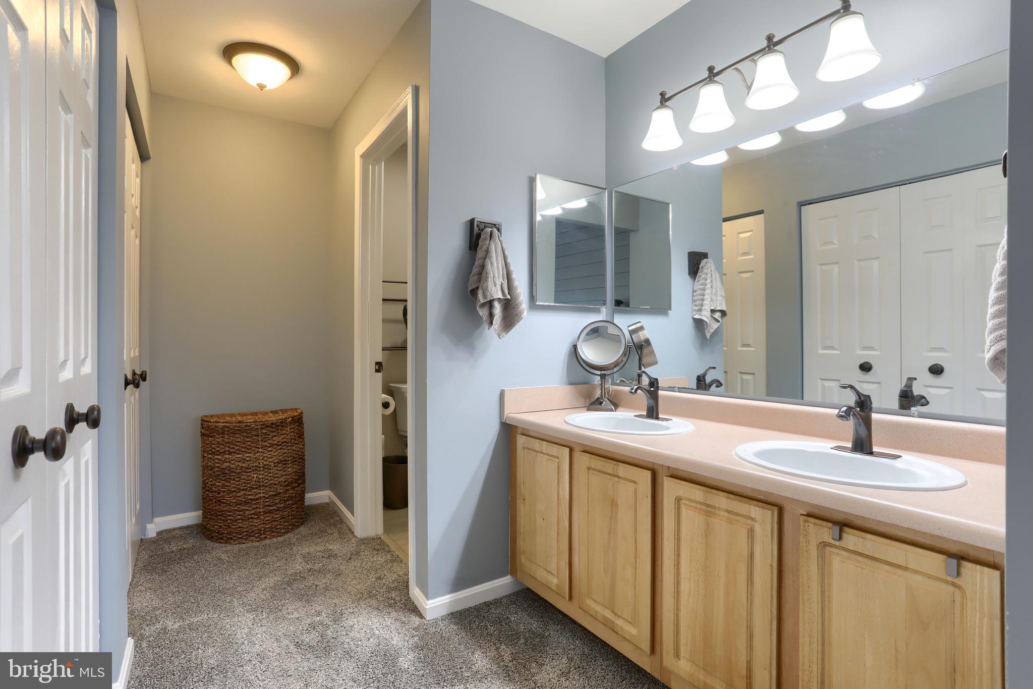 6456 Terrace Court Harrisburg, PA 17111 - Photo 23 of 39 a bathroom with a sink double vanity and a mirror