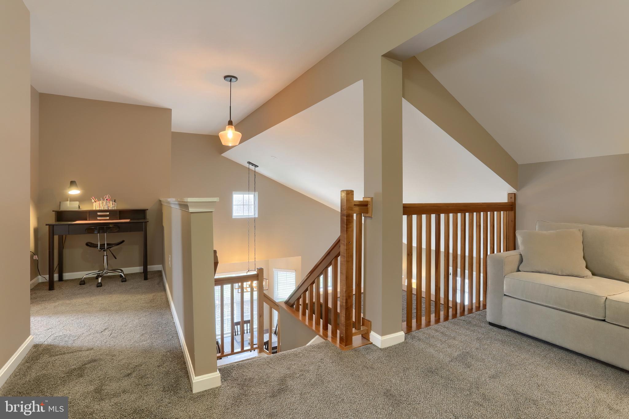 6456 Terrace Court Harrisburg, PA 17111 - Photo 27 of 39 a view of a livingroom with stairs and furniture