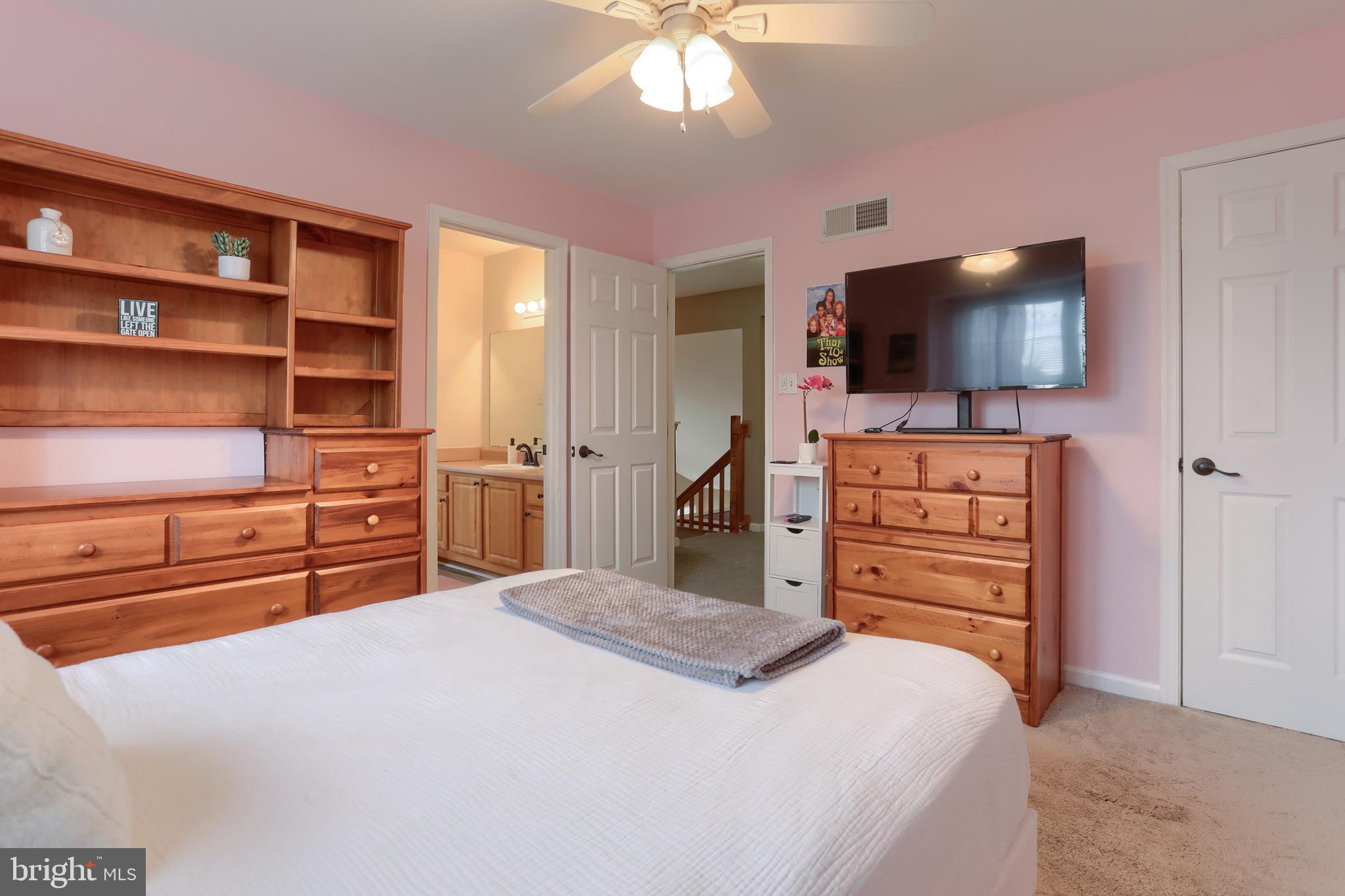 6456 Terrace Court Harrisburg, PA 17111 - Photo 29 of 39 a bedroom with a bed and a flat screen tv
