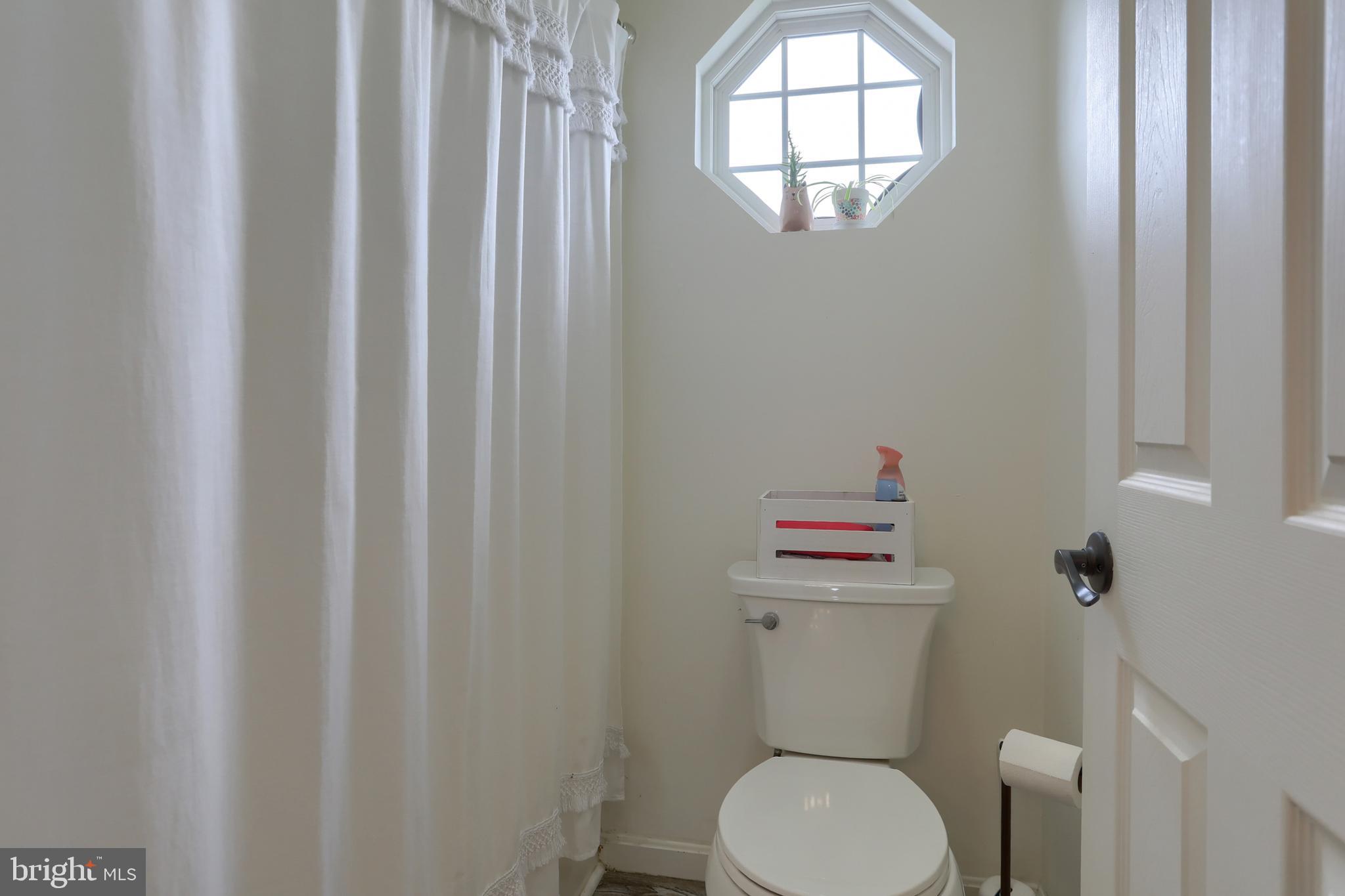 6456 Terrace Court Harrisburg, PA 17111 - Photo 31 of 39 a white toilet sitting next to a small bathroom