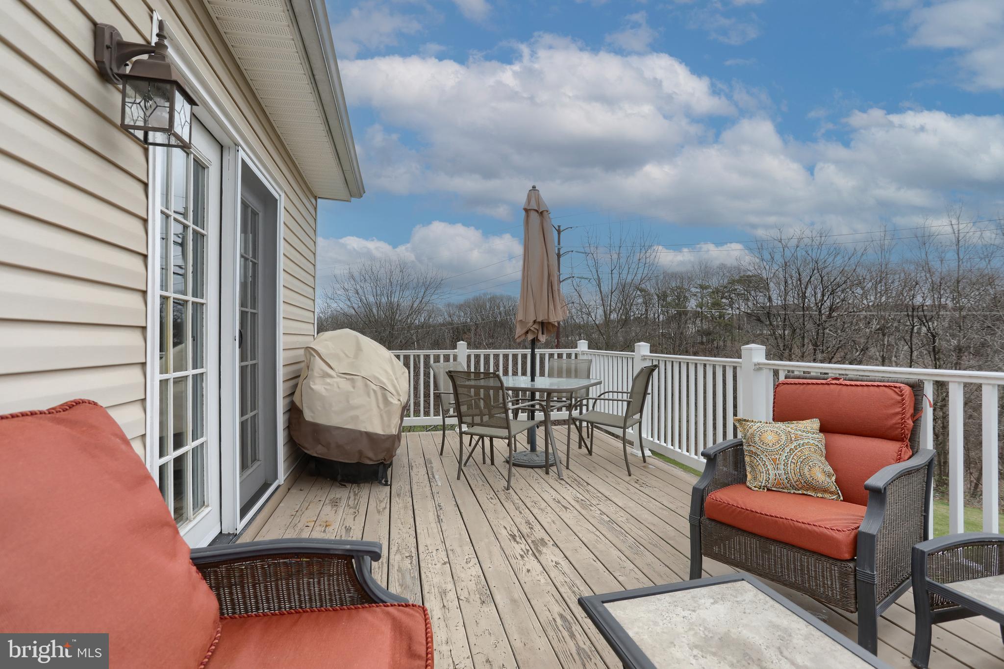 6456 Terrace Court Harrisburg, PA 17111 - Photo 36 of 39 a balcony with wooden floor table and chairs