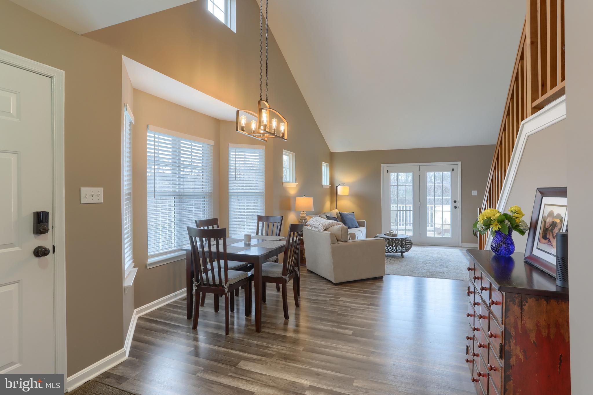 6456 Terrace Court Harrisburg, PA 17111 - Photo 6 of 39 a view of a dining room with furniture window and wooden floor