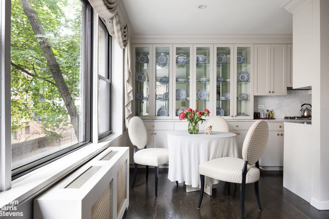 342 East 53rd Street, Unit 2GH Manhattan, NY 10022 - Photo 3 of 9 a dining room with furniture window wooden floor and garden view