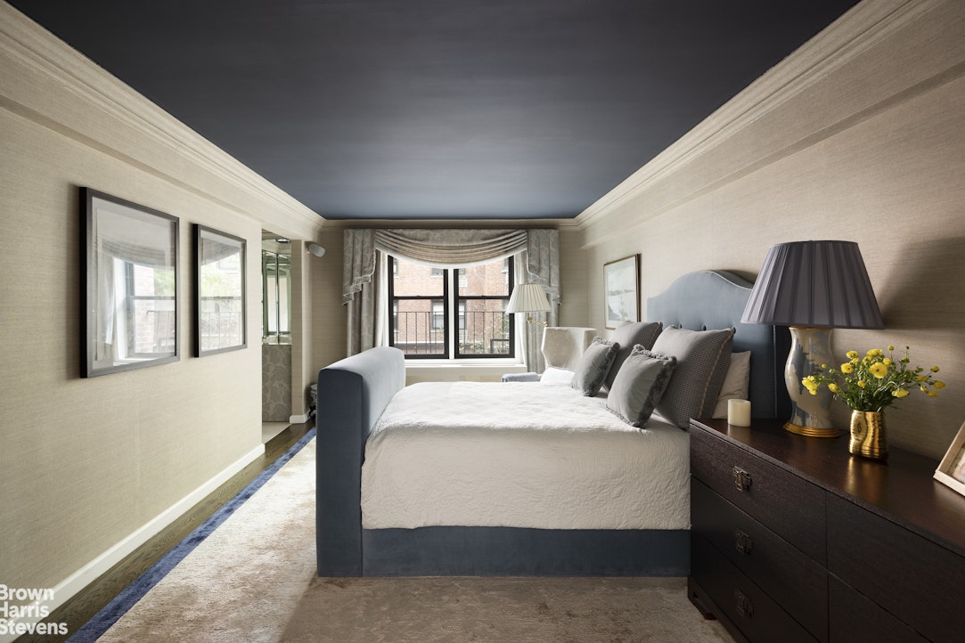 342 East 53rd Street, Unit 2GH Manhattan, NY 10022 - Photo 5 of 9 a bedroom with bed and wooden floor