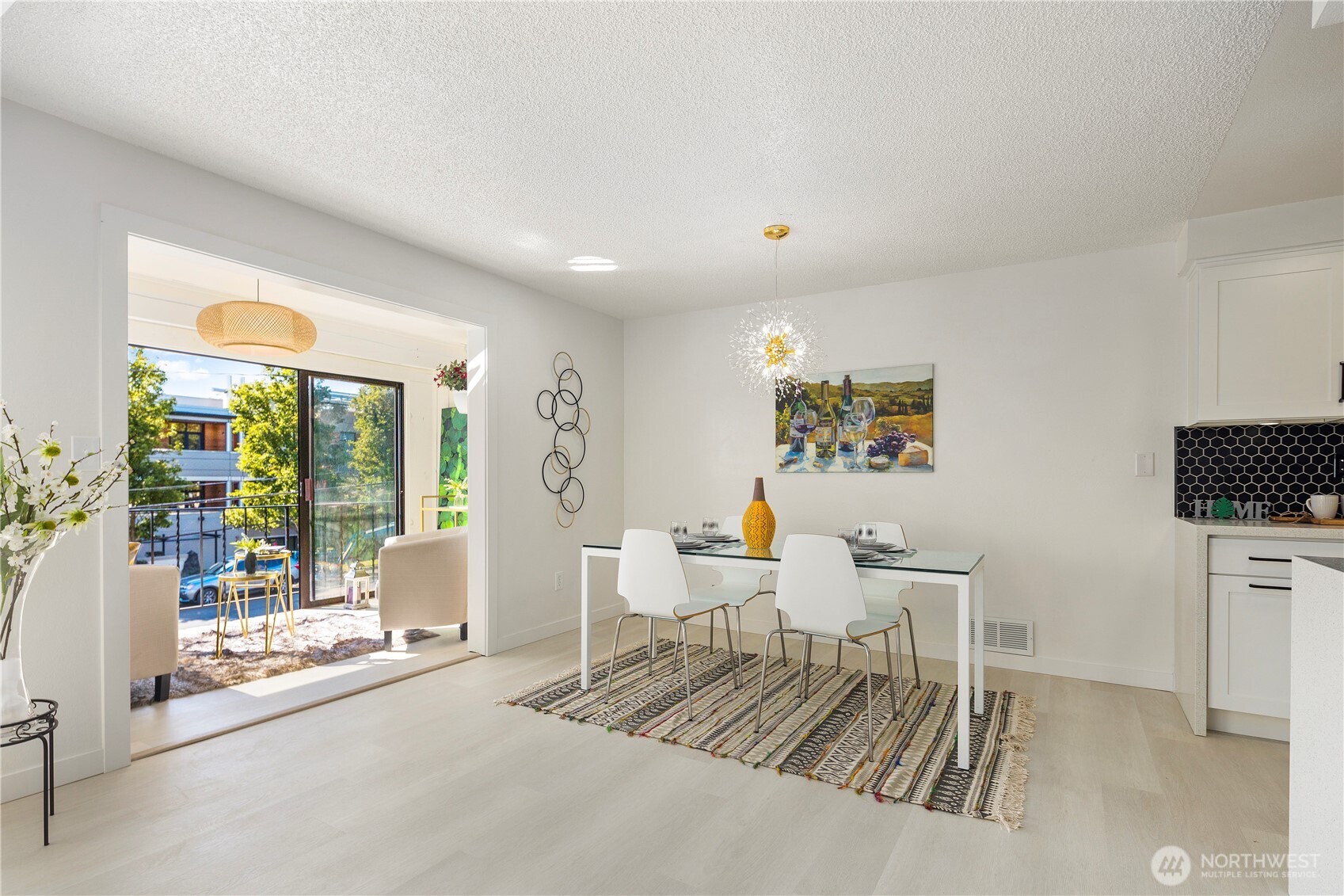 22532 6th Avenue South, Unit A2 Seattle, WA 98198 - Photo 11 of 35 a living room with furniture a flat screen tv and a floor to ceiling window