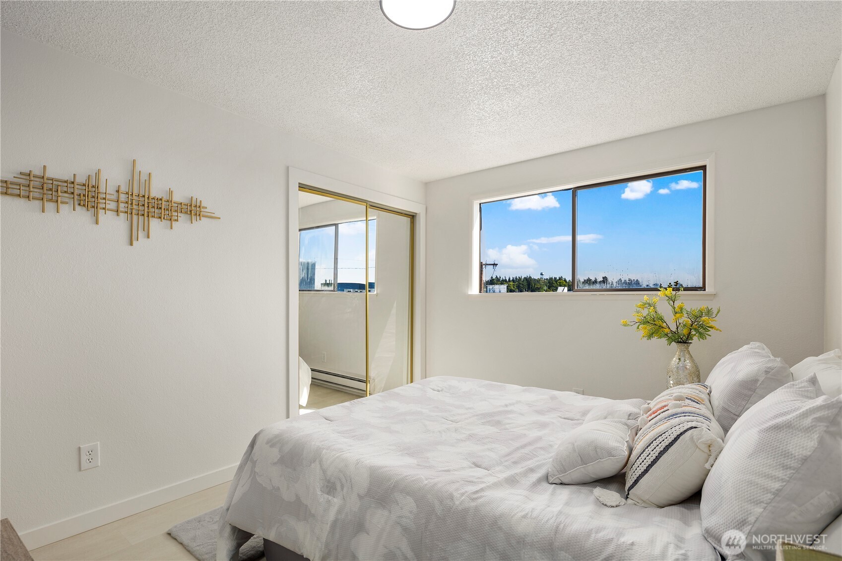 22532 6th Avenue South, Unit A2 Seattle, WA 98198 - Photo 18 of 35 a bedroom with a bed and a window