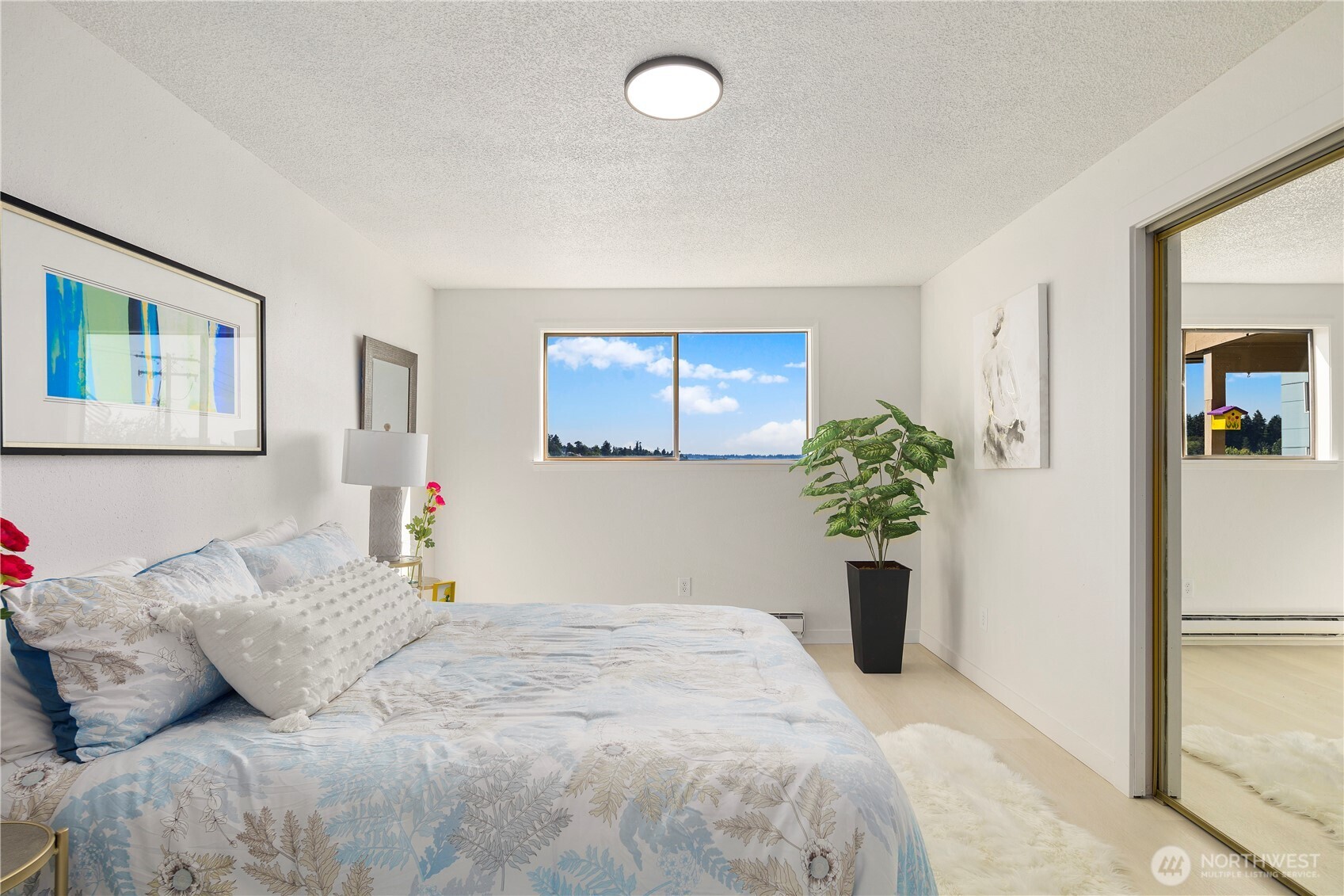 22532 6th Avenue South, Unit A2 Seattle, WA 98198 - Photo 21 of 35 a bedroom with a balcony and a potted plant