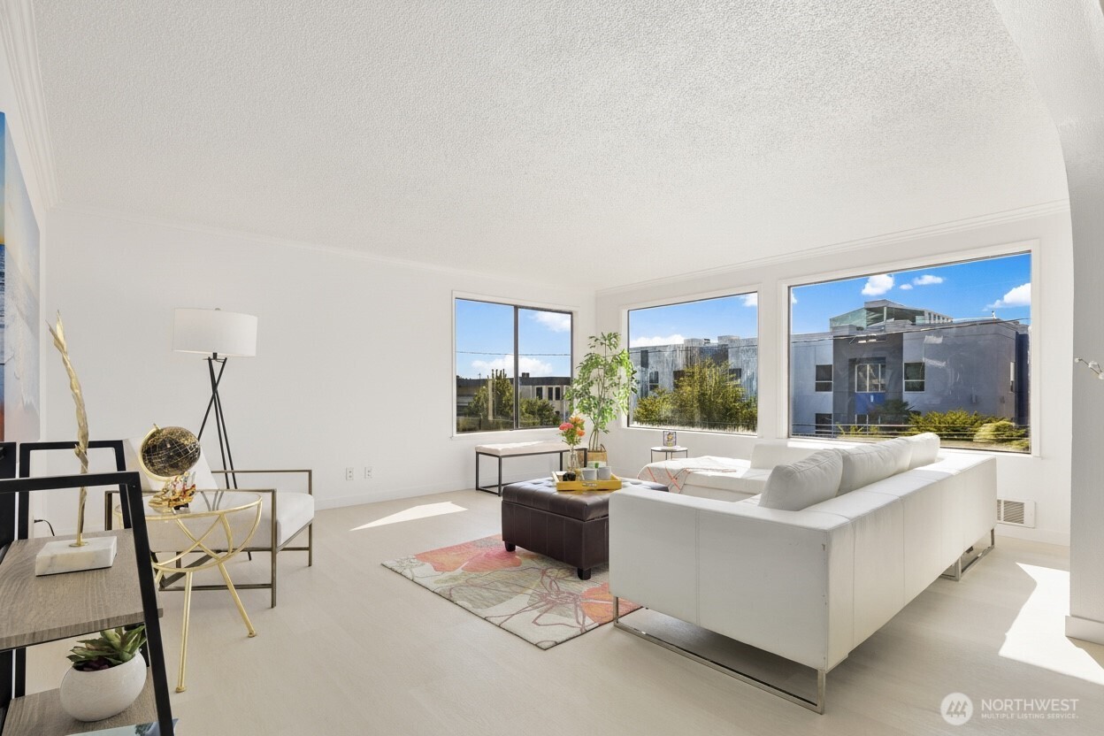 22532 6th Avenue South, Unit A2 Seattle, WA 98198 - Photo 3 of 35 a living room with furniture and large windows