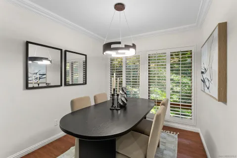 a dining room with furniture and window