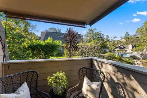a view of balcony with furniture
