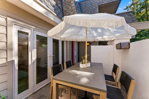 a patio with table and chairs