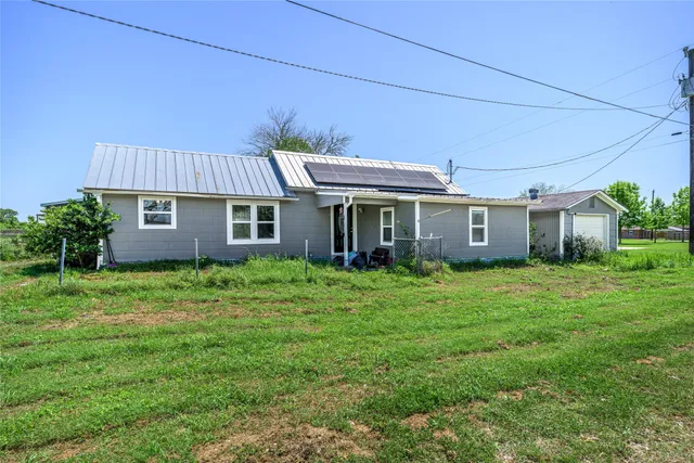 front view of a house and a yard