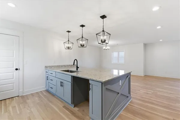a view of room with window ceiling fan and hardwood floor