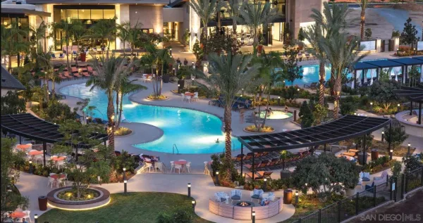 a view of a two chairs and table in a patio