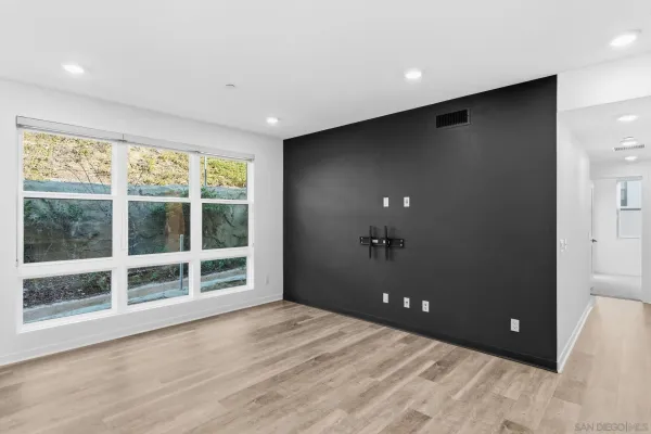 a view of an empty room with a window